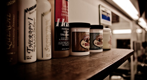 AoM_Brewing-1 Hair spray bottles and other products.