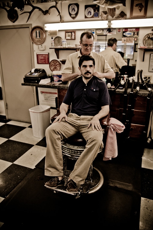 AoM_Brewing-12 A man sitting at barbershop for hair cut.