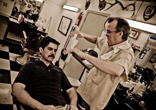 AoM_Shaving-81 Barber pouring the warm towel.