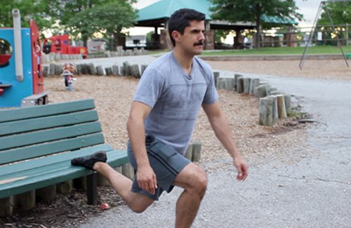 Vintage man doing Bulgarian&nbsp;split squat exercise.