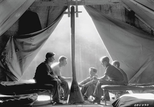 Civilian Conservation Corps Vintage men sitting in a tent.