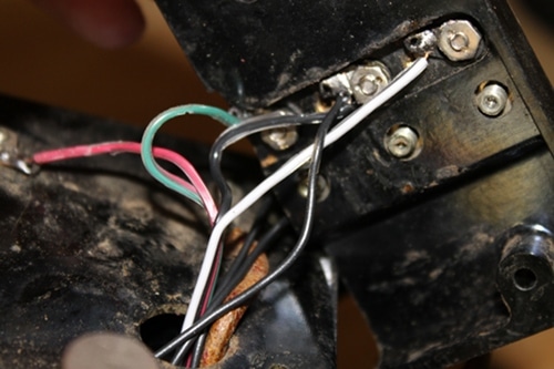 Vintage threading through the hole on top of the field phone.