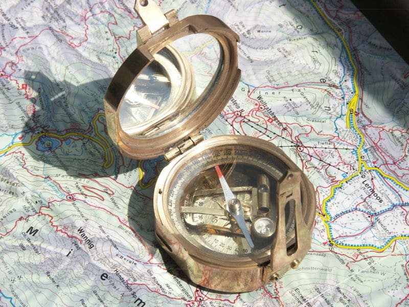 A map with a compass for finding north.