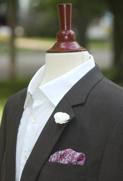 Jacket with pocket square and boutonniere.