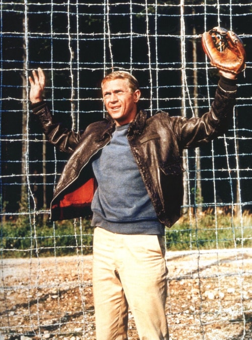Steve mcqueen wearing baseball mitt in hand. 