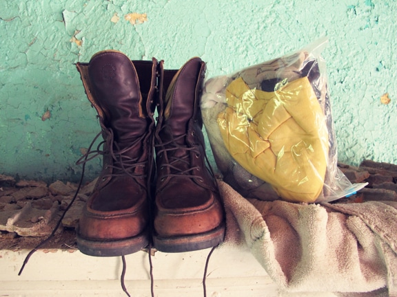 Boots and clothes placed in the disaster house.