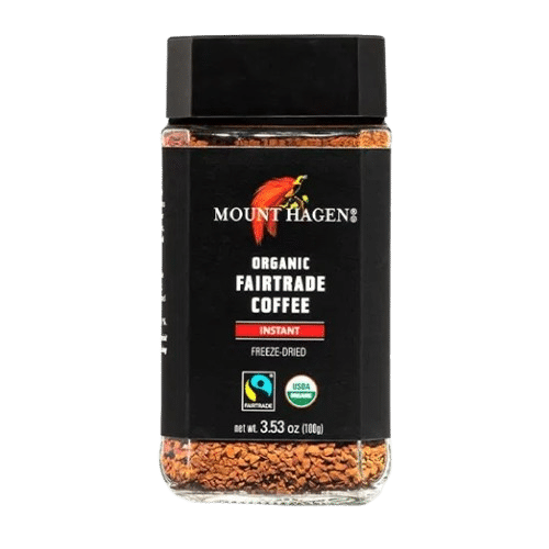 A glass jar of Mount Hagen Organic Fairtrade Instant Coffee with a black lid and certification labels, perfect for those seeking the best instant coffee experience.